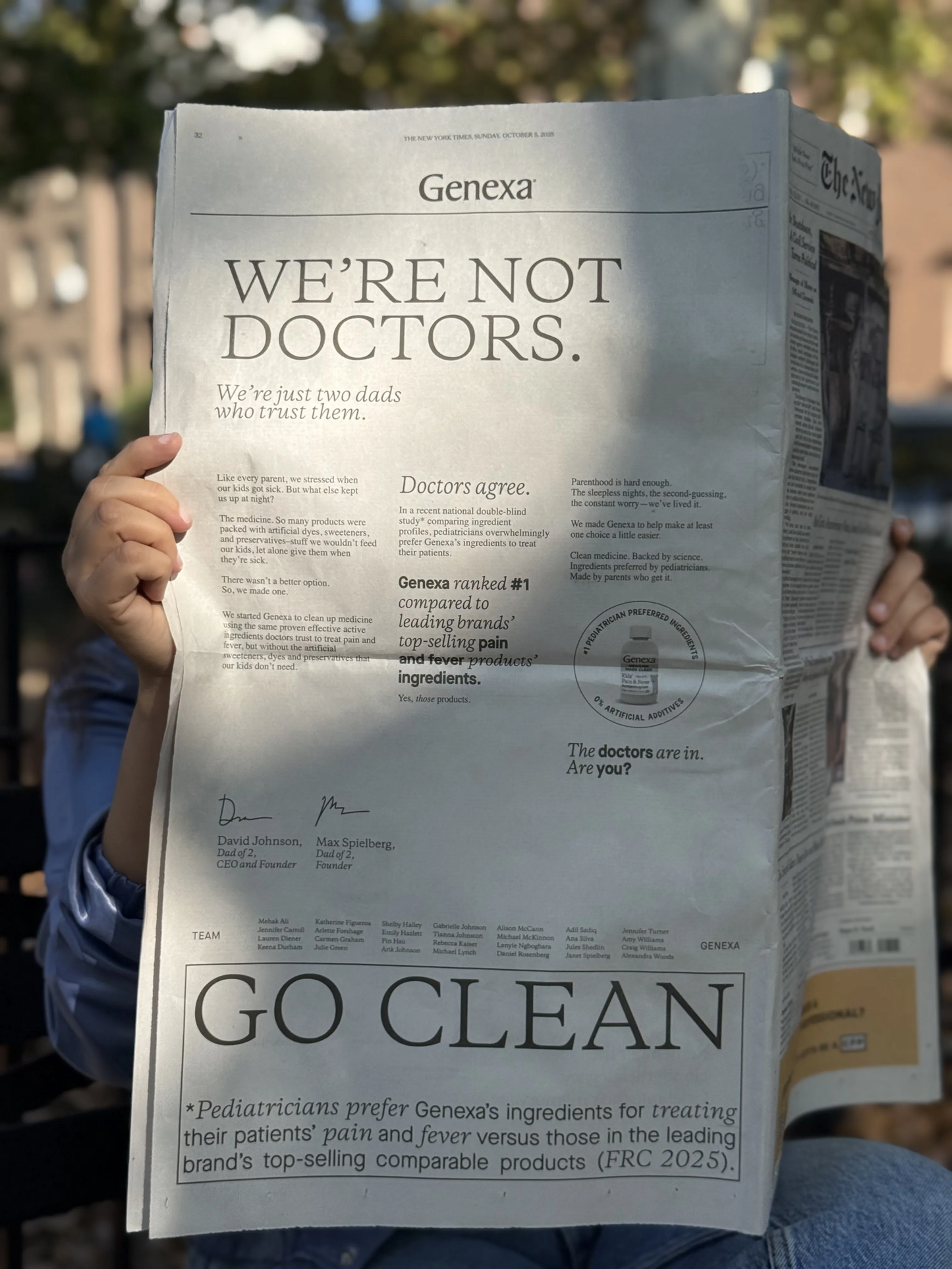 Person holding a Genexa advertisement in a newspaper